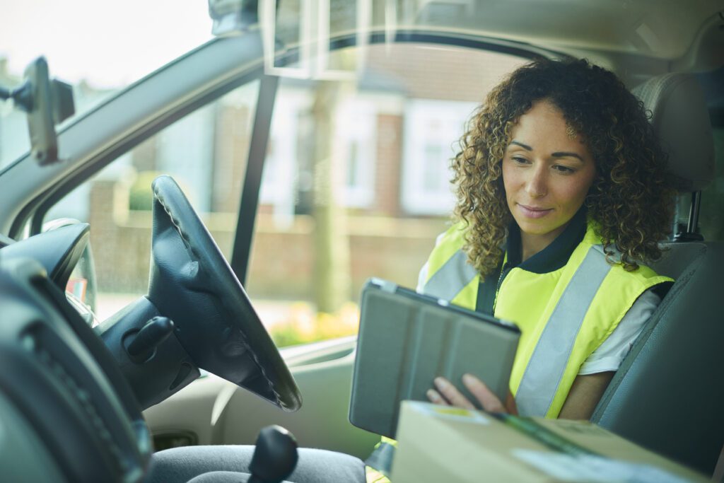 Delivery driver uses recurring delivery scheduling app to optimize her route. 