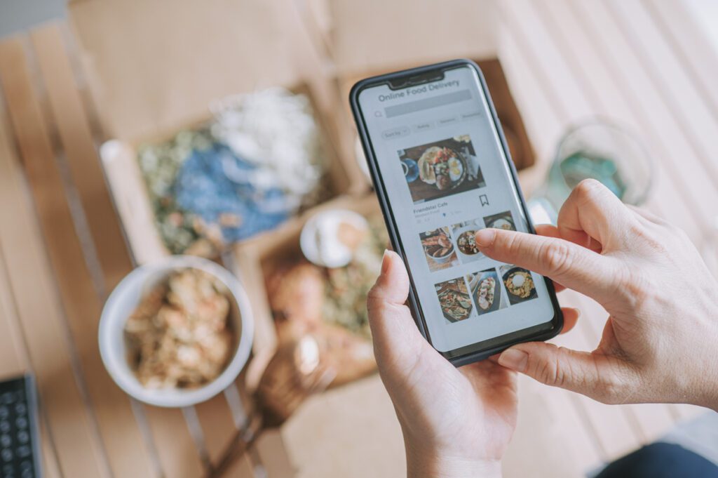 A customer places an on-demand food order through their phone. 